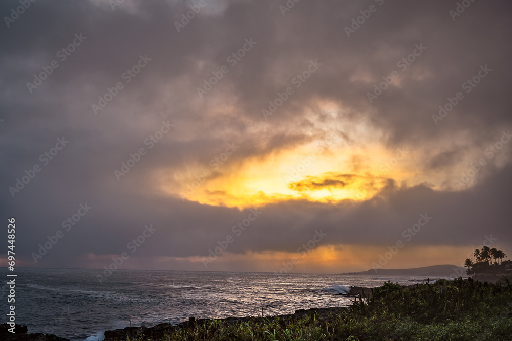 2023-12-23 SUNSET ON POI PU BEACH WITH NICE ORANGE ADN YELLOW COLORS ADN THE SHORELINE ON KAUAI HAWAII