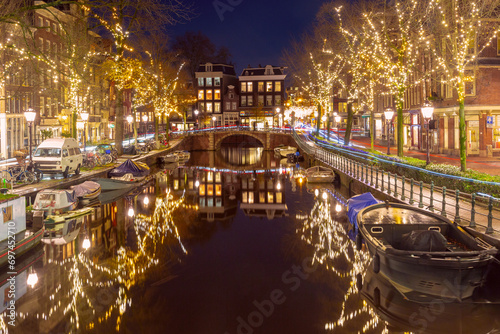 Night Amsterdam canal Spiegelgracht with typical dutch houses, Holland, Netherlands.
