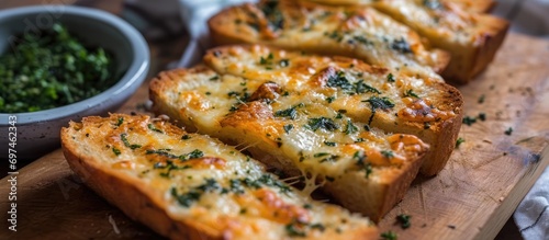 Cheesy garlic bread made at home with herbs and spices. photo
