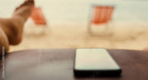 Smart phone on the beach side
