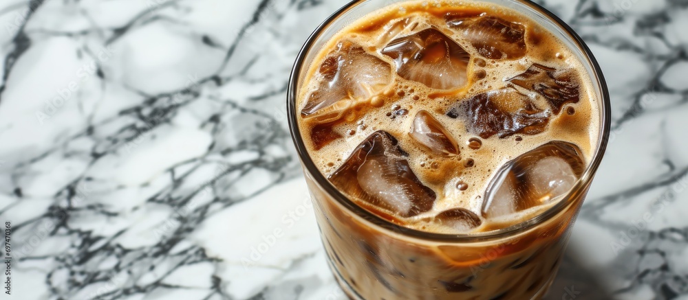 Iced coffee resting on the marble table. Iced coffee resting on the marble table.