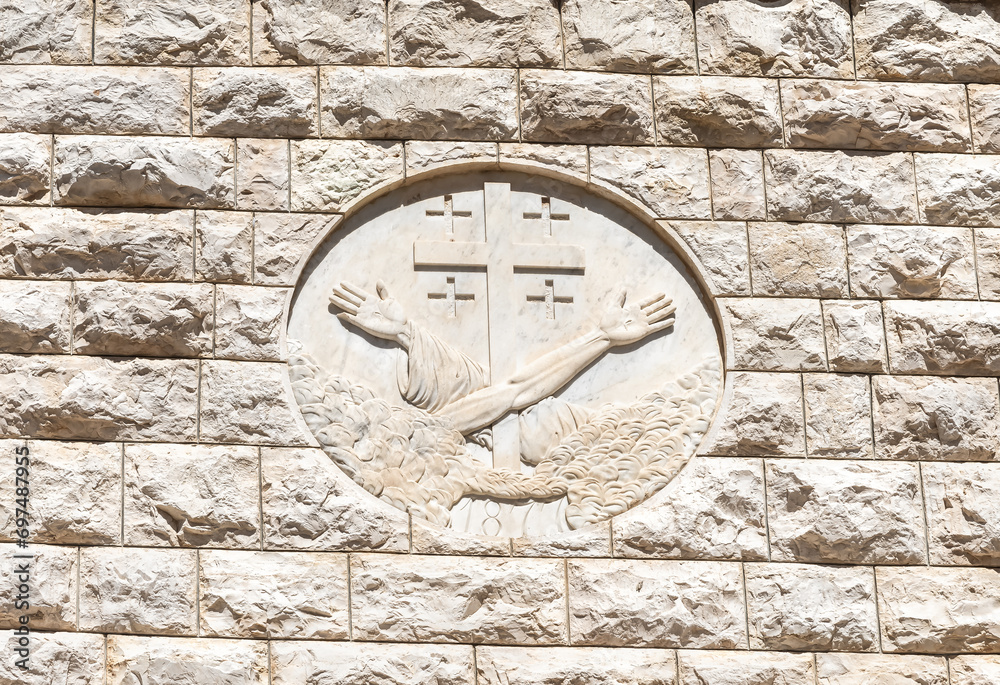 The Vatican coat of arms is carved in stone on the wall of the Church of the Annunciation in the Nazareth city in northern Israel