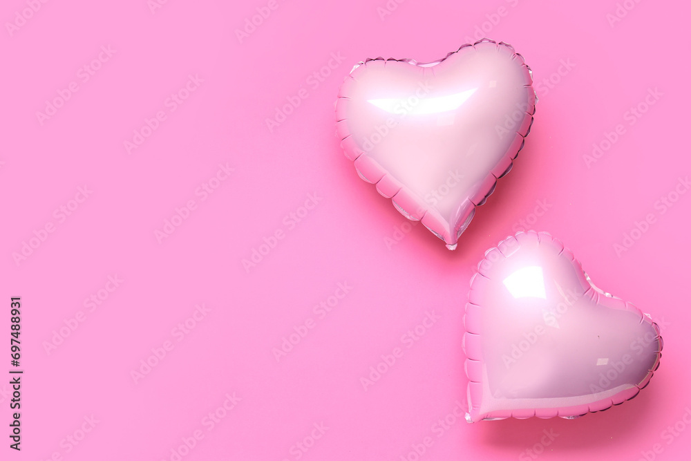 Heart shaped air balloons on pink background. Valentine's day celebration