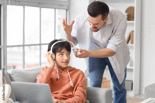 Angry father arguing with h...