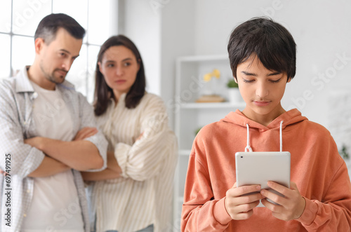 Teenage boy using tablet co...