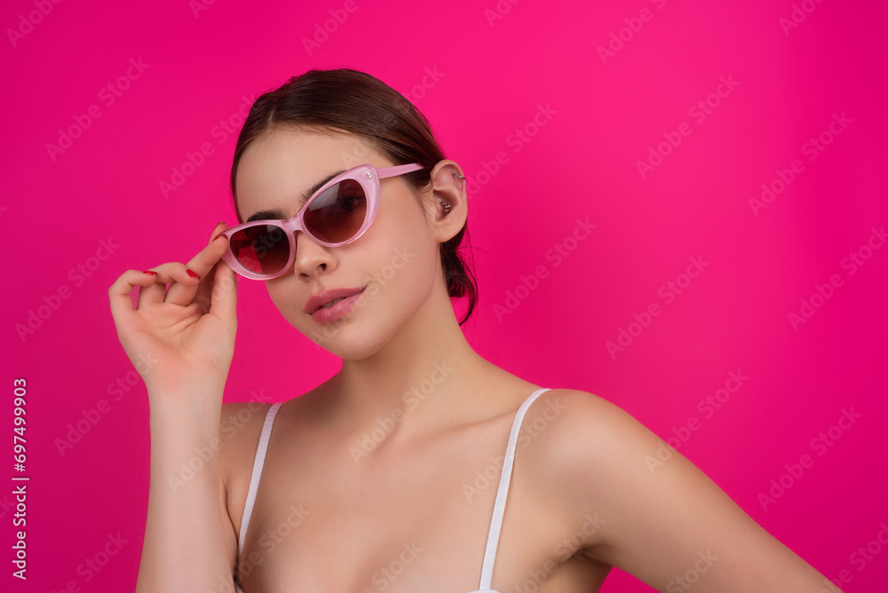 Beauty face of young woman. Sexy model posing in studio. Portrait of beautiful girl. Beauty woman face closeup. Pretty girl face on studio background. Sensual look. Beautiful female face.