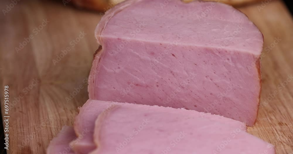sliced piece of pork ham, slicing a finished piece of ham into small pieces sliced piece of pork ham, slicing a finished piece of ham into small pieces