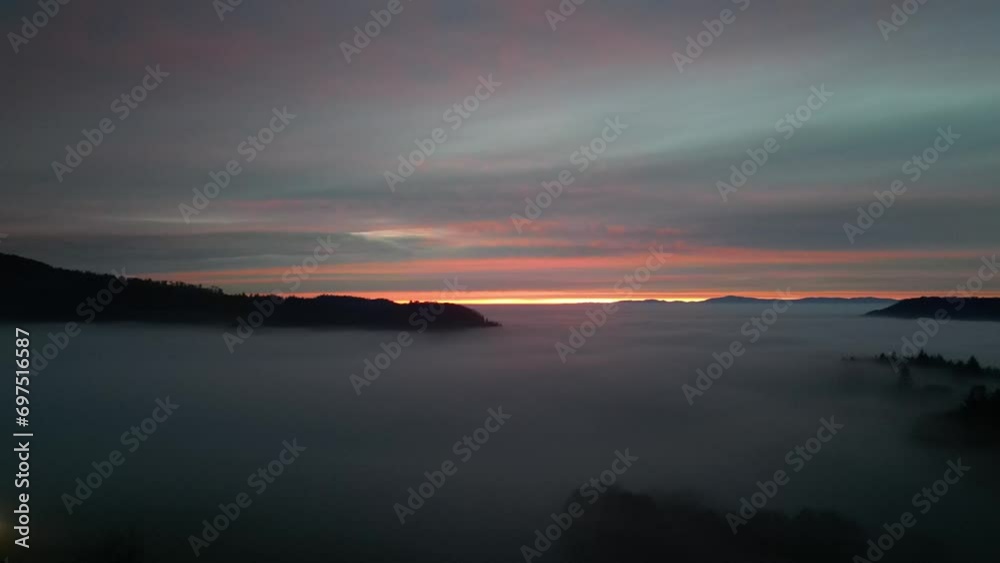 drone shot of alpine landscape with fog at sunset drone shot of alpine landscape with fog at sunset