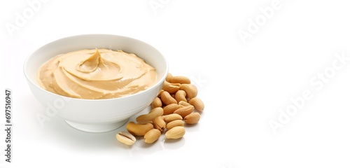 peanut butter in a bowl sprinkled with peanuts on the side on a white background. generative AI