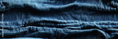 seamless texture pattern with seams and pleats of blue denim on the jeans background