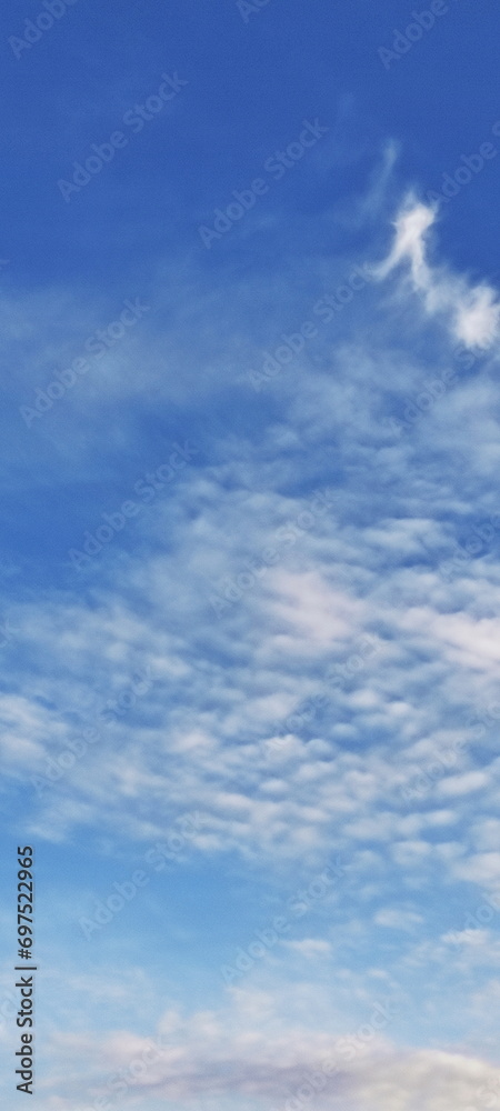 Beautiful blue sky with clouds vertical view screensaver background texture
