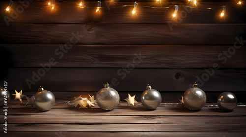 Christmas background with lights and baubles on dark wooden boards, festive festive backdrop
