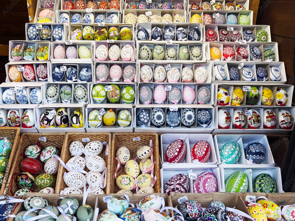 Selective focus on a colorful Easter stall at the market with traditional decorative eggs.