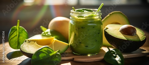 fresh avocado juice in a jar with mint leaves on top