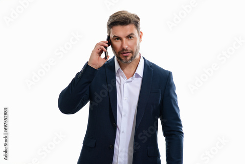 Handsome business man in suit using smartphone, chatting, making post on social media. Businessman call on phone isolated over studio background. Blogger talking on phone.