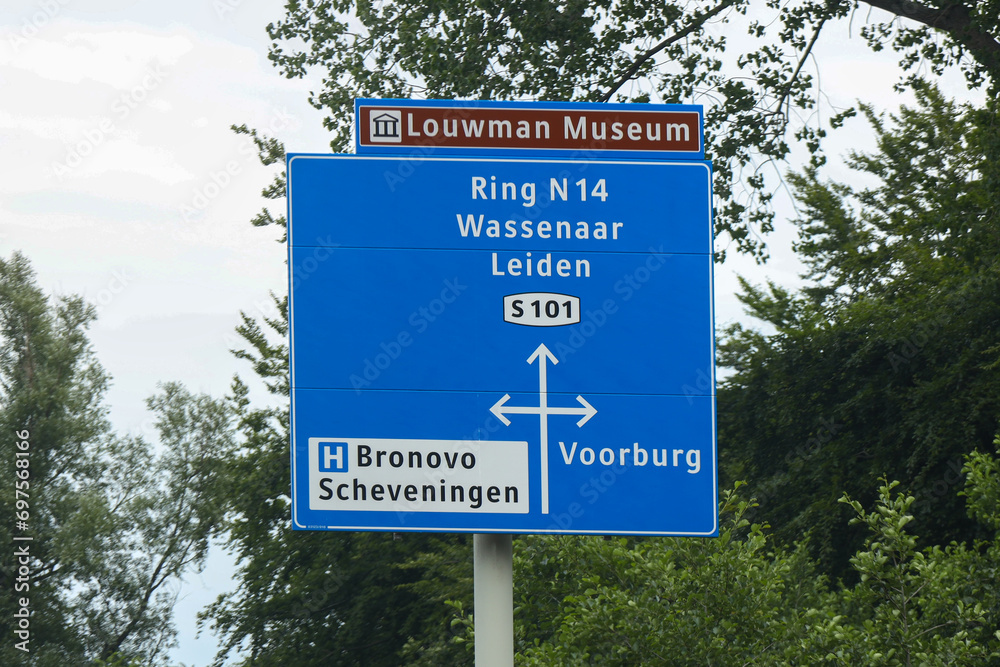 Direction signs to Wassenaar and Leiden at local S101 road in The Hague