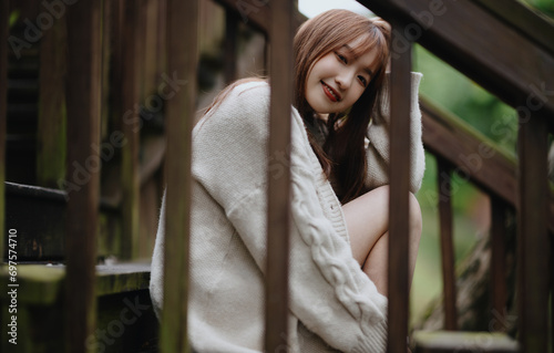 portrait of an asian young woman aty the park photo