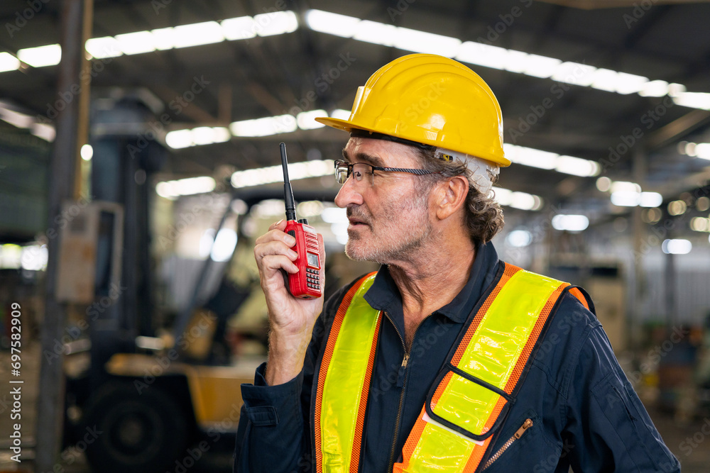 engineer use walkie talkie at machine factory engineer use walkie talkie at machine factory