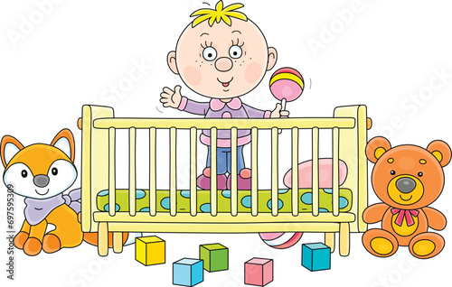 Happy little child in a small cot and funny colorful toys for playing in a nursery room, vector cartoon illustration on a white background