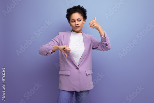 young successful hispanic brunette leader woman with curly hair dressed in a business suit