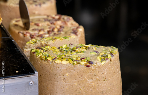 Halva with pistachio nuts for sale at city market photo