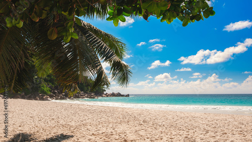 Palm and tropical beach panorama. Anse Lazio beach at Praslin island  Seychelles  long exposure  vintage toning