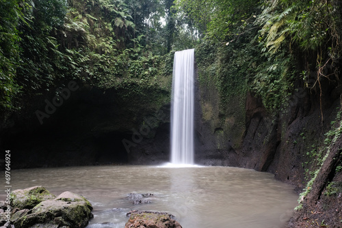View of Tibumana waterfall on cloudy day. Bali, Indonesia. photo
