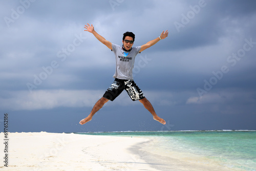 Jumping into the paradise in Maldives