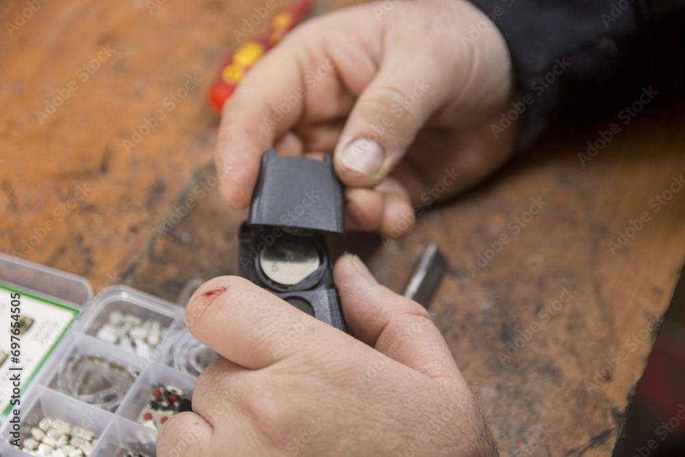 Fototapeta premium Man fixing car key