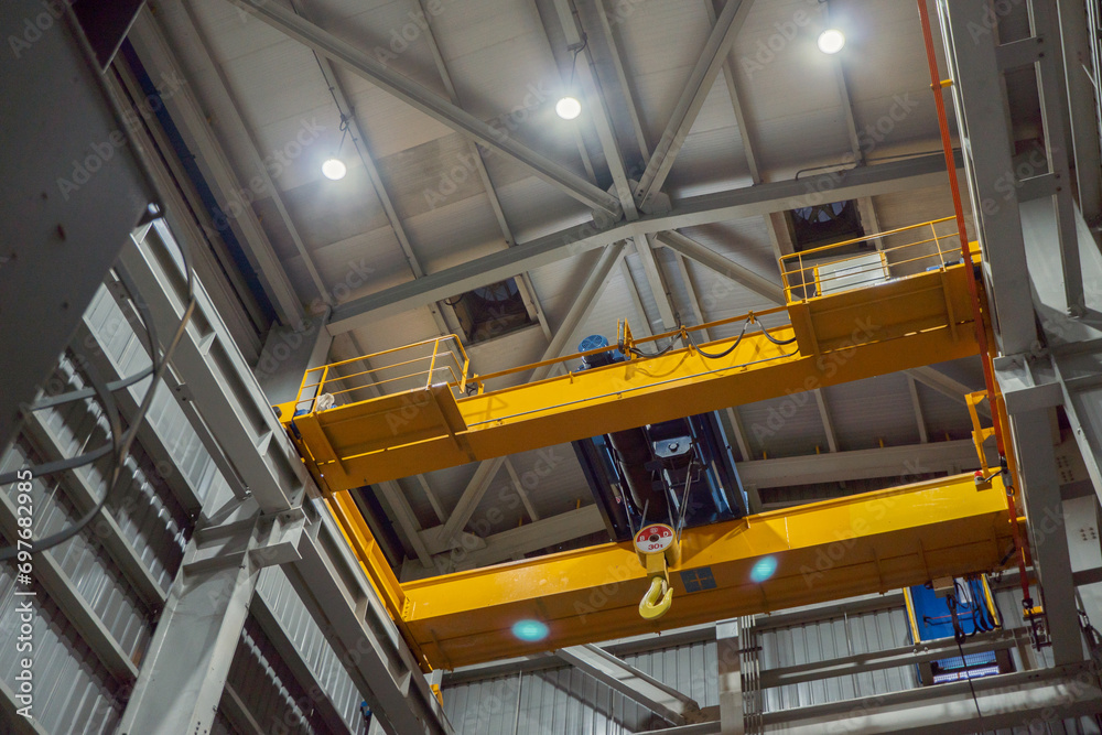 Unit overhead crane on the power plant project for maintenance purpose. The photo is suitable to use for industry background photography, power plant poster and maintenance content media. Unit overhead crane on the power plant project for maintenance purpose. The photo is suitable to use for industry background photography, power plant poster and maintenance content media.