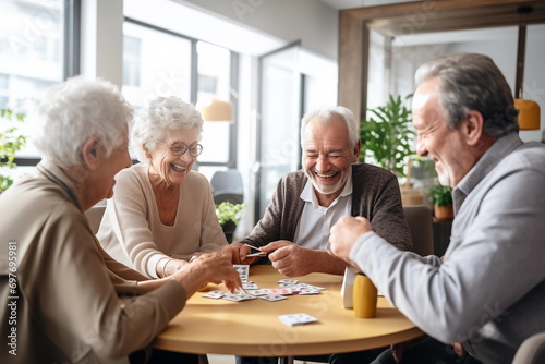 elderly people in the nursing home are play card games. Happy old age concept photo