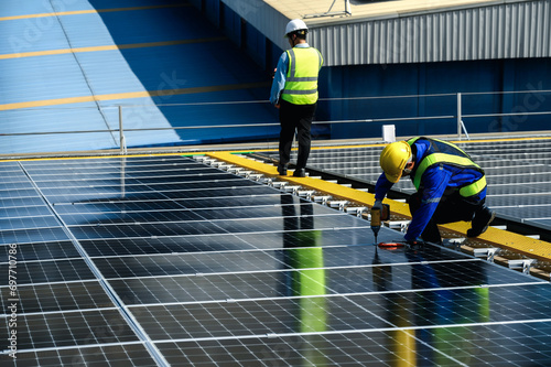 Wallpaper Mural Engineer Inspector Quality in Solar Roof Panel Installation with Worker Installation, Overview of Quality Control in Work of Sustainable Photovoltaic Installation on Factory Roof Buildings. Torontodigital.ca