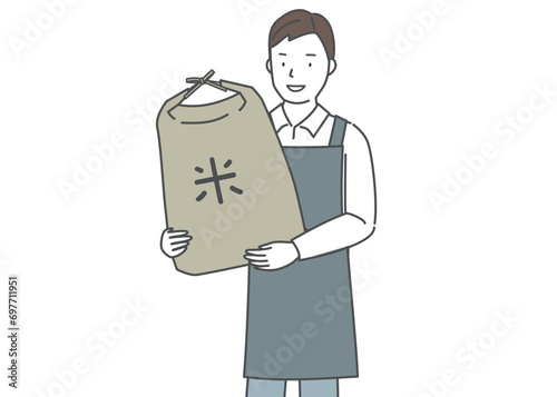 米袋を抱える米屋の店員