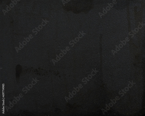 Texture of dark cast iron surface photo