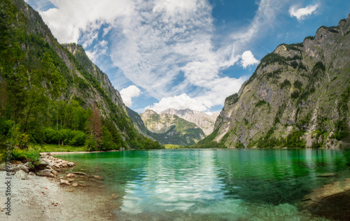 Fototapeta Naklejka Na Ścianę i Meble -  The crystal clear water of the Obersee in Berchtesgaden invite to to relax and reload all batteries