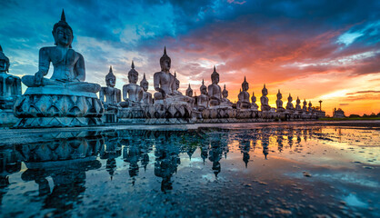 Many Statue buddha image at sunset in southen of Thailand