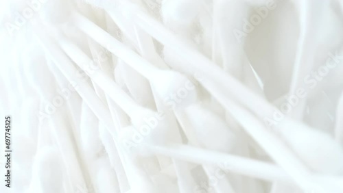 White cotton swabs, cotton swab on a clean white background. Vertical video photo