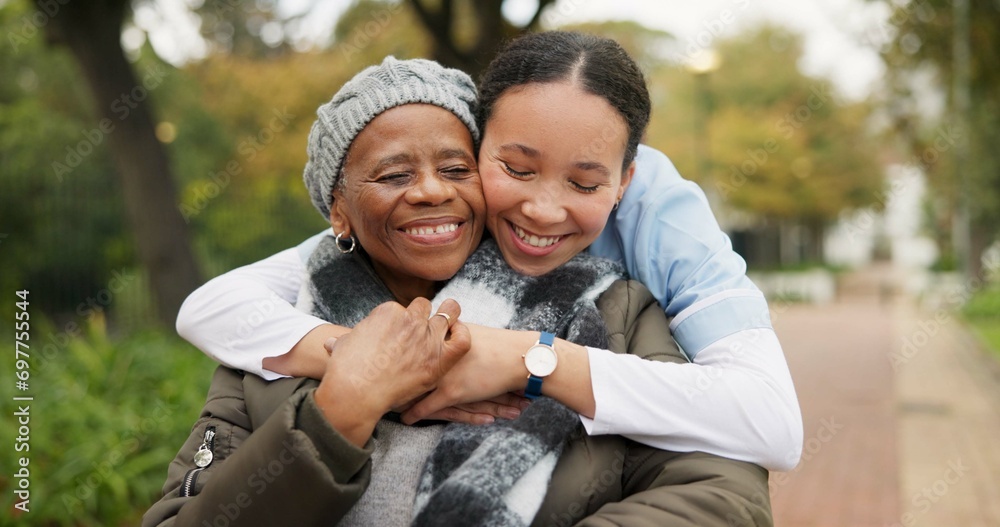 Caregiver, hug and park with old woman in a wheelchair for retirement, elderly care and physical therapy. Trust, medical and healthcare with portrait of patient and nurse in nature for rehabilitation Caregiver, hug and park with old woman in a wheelchair for retirement, elderly care and physical therapy. Trust, medical and healthcare with portrait of patient and nurse in nature for rehabilitation