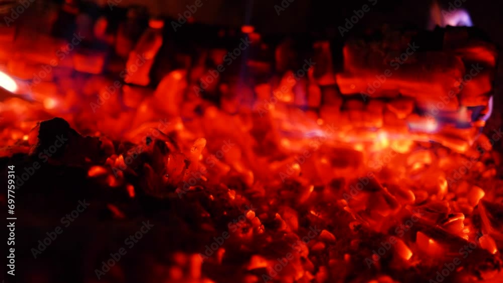 Coals smolder in a stone fireplace Coals smolder in a stone fireplace