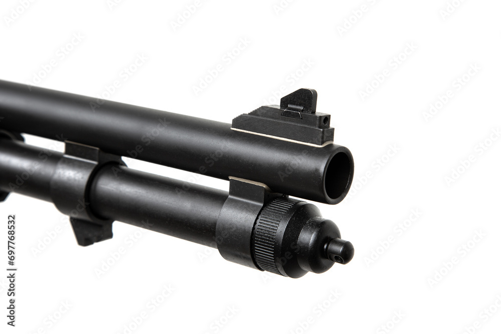 Pump-action 12 gauge shotgun isolated on a white background. Additional handle. A smooth-bore weapon with a plastc stock. Pump-action 12 gauge shotgun isolated on a white background. Additional handle. A smooth-bore weapon with a plastc stock.