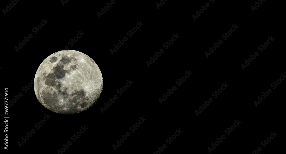 Full detail moon closeup on a black background with stars visible Full detail moon closeup on a black background with stars visible