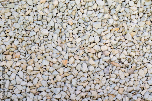 Finely ground zeolite mineral stones. A spread of small pebble-like fragments.