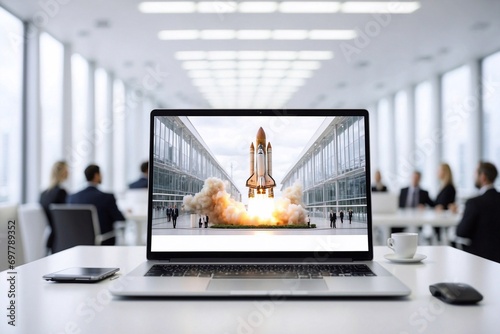 rocket launch simulation on laptop in futuristic office setting, digital liftoff photo
