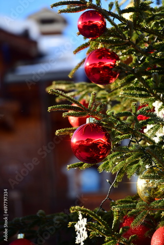 Decorated christmas tree branch with red balls 