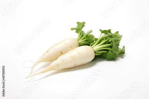 a pair of white radishes with green leaves