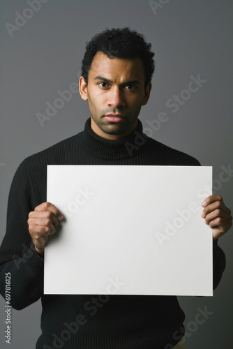 man holding a empty white sign