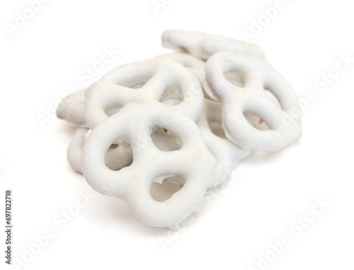 White chocolate covered pretzels on white background 