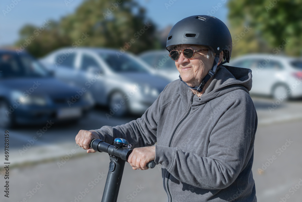 elderly woman riding an electric scooter elderly woman riding an electric scooter