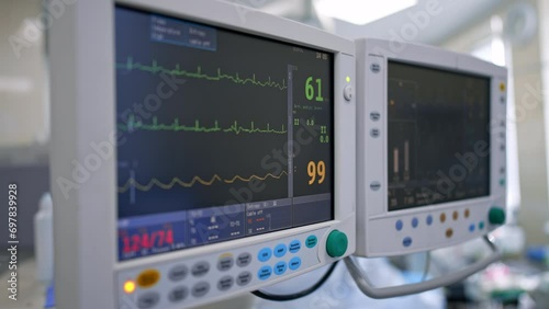 Pulse and heart rate of a patient during the surgery. Close up look at the monitors of lung ventilating machine. photo