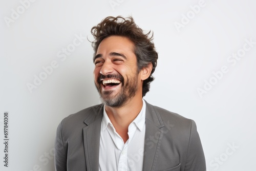 Portrait of a happy man laughing. Isolated on white background.